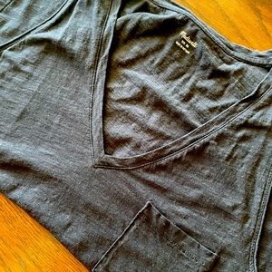 Madewell pocket tank, black in color.